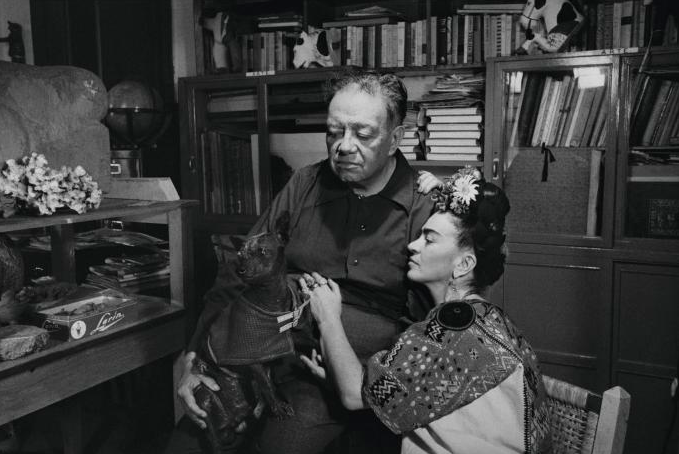 Black and white photo of FRIDA KAHLO AND DIEGO RIVERA WITH A DOG, MEXICO CITY, 1952. (PHOTO BY MARCEL STERNBERGER/COURTESY STEPHAN LOEWENTHEIL/GETTY IMAGES)